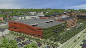 Nearly 700 surface parking spaces on the Athenahealth campus in Watertown would be replaced with a 7-story garage covered in living walls and metal foil skin under a redevelopment plan.