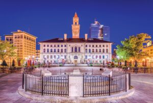 A photo of worcester city hall at night with its facade lit up.