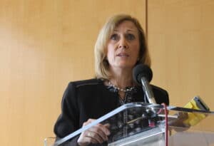 Massachusetts Taxpayers Foundation President Eileen McAnneny speaks from a podium
