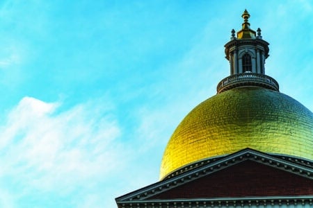 Sun reflecting off the golden dome of the Massachusetts State House