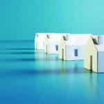 Real estate concept with houses to buy. Searching property, homes for sale, mortgage, transaction. Minimalist models on blue background.