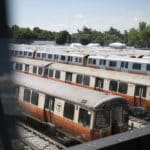 Old and new Orange Line trains sit in the MBTA's Wellington repair yard in August 2022.