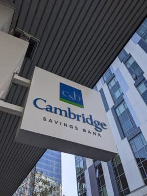 A Cambridge Savings Bank sign over the lender's Kendall Square ATM
