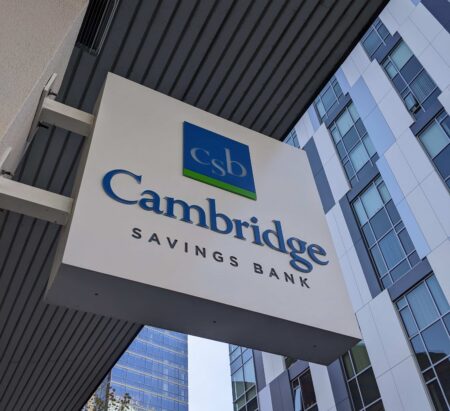 A Cambridge Savings Bank sign over the lender's Kendall Square ATM