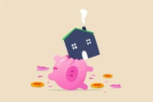 House expense and cost, too expensive payment or high interest rate mortgage concept, heavy house broke savings piggybank metaphor of too much payment and cost.
