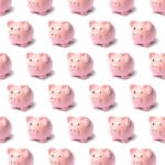 Pattern from a pink piggy bank on a white background.
