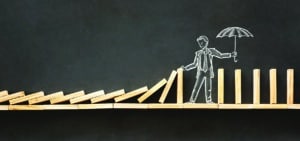 Domino Effect and Business Challenge Concept with Hand Drawn Chalk Illustrations on Blackboard