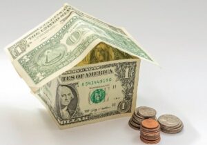 A model of a house made of dollar bills