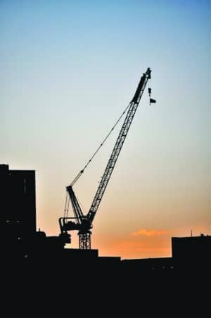 A resting crane on the Cambridge side of Charles River in Boston Area. The Crane is working around Kendall Square in Cambridge and the photo is taken from across the river on the Boston Side.