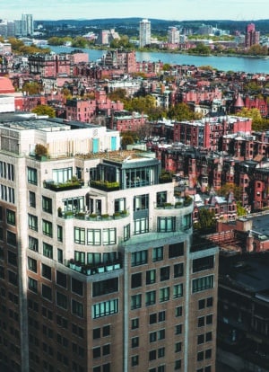 A shadow falls over a high rise luxury building in the Back Bay neighborhood of Boston near the Charles River