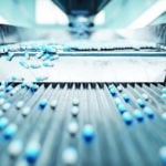 Sorting pharmaceutical capsules by a sorting machine on a production line