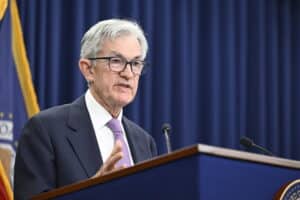 Federal Reserve Chair Jerome Powell speaking from behind a lectern.