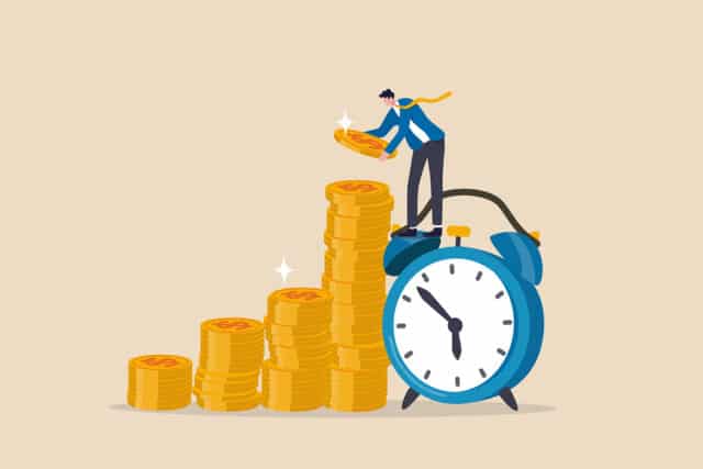 person standing on top of a clock stacking up coins