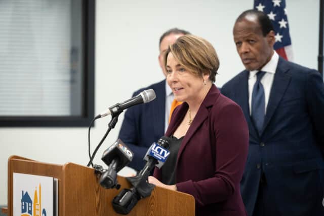 Gov. Maura Healey addresses an audience at the Lynn Housing Authority headquarters.