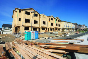 Portland, OR, USA - May 7, 2023: New townhomes under construction in a large suburban community developed by Taylor Morrison at the Bethany neighborhood in northwest Portland, Oregon.
