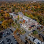 Wellesley Sues to Block Housing on MassBay Parking Lot