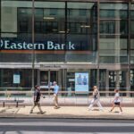 Pedestrians walk past Eastern Bank's branch on Franklin Street in downtown Boston on June 8, 2026.