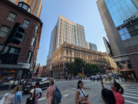The sun-lit Kensington apartment tower in Boston's Theater District is shown from the corner of Essex and Washington Streets on the evening of July 8, 2026.